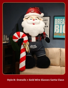 Detail of Santa Claus plush toy with gold glasses and Merry Christmas embroidery