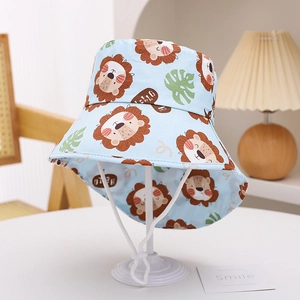 Close-up of kids light blue sun hat with lion print and adjustable white chin strap