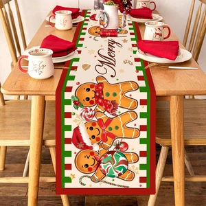 Gingerbread man Christmas table runner with red and green stripes on a wooden table