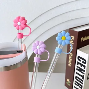 Daisy silicone straw covers for Stanley cups set in pink, blue, and purple flower shapes
