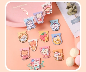 Flat lay of colorful cartoon magnetic bookmarks with cute animals and food patterns