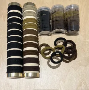 Elastic seamless hair ties set in earth tones on a wooden background
