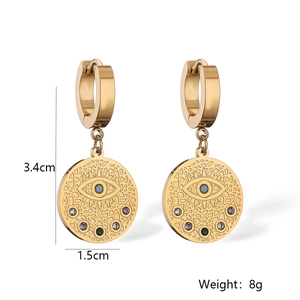 Detail of gold Evil Eye hoop earrings showing multi-color gems and 3.4cm length