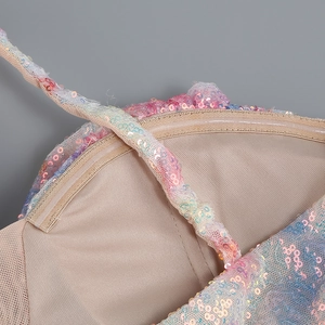 Close-up of holographic sequins, nude knit lining and non-slip silicone strip on dress