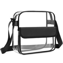 Detail of transparent PVC crossbody bag featuring black trim and adjustable shoulder strap