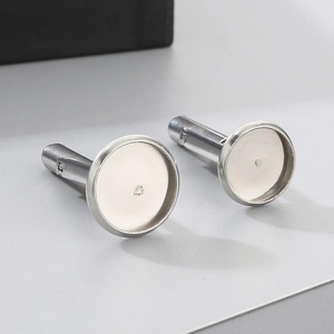 Macro detail of silver stainless steel round cufflink bases for DIY jewelry making