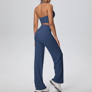 Rear view of deep blue halter sports top and high-waisted wide-leg yoga pants set