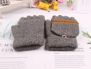 Detail of gray knitted kids flip-top mittens with colorful stripes and wooden button
