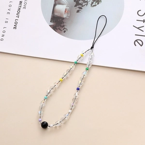 Detailed shot of handmade beaded phone lanyard with colorful crystal stones and wrist strap