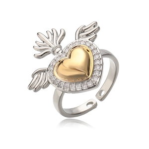 Sacred heart wing ring with gold heart center and zircon accents in two-tone finish