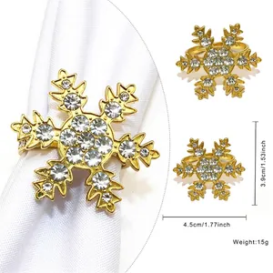 Detailed dimensions of a golden snowflake napkin ring with sparkling white rhinestones