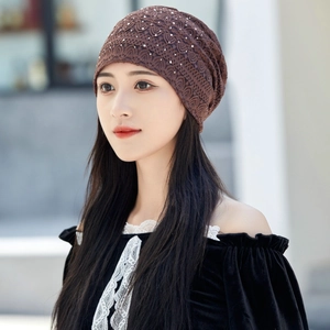 Brown lace beanie for women with white pearl embellishments and flower textures