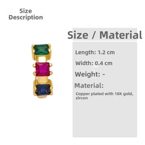 Detail view of gold-plated ear cuff with emerald, pink, and blue zircon gemstones