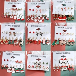 Detailed grid showing Christmas earring set with Santa Claus and reindeer designs