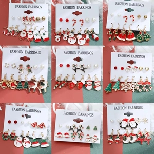 Detail view of colorful Christmas earring sets featuring snowman and reindeer designs