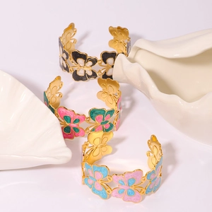 Golden butterfly open cuff bracelet with colorful enamel inlay in floral geometric design