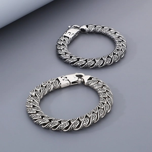 Vintage silver titanium steel bracelet with engraved floral patterns and spring clasp