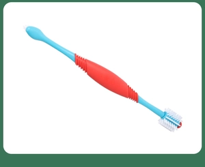 Detail of double-headed pet toothbrush with blue and red bristles for dog dental care