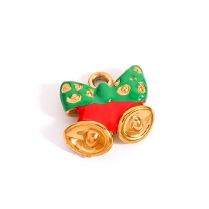 Detail of Christmas metal pendant with green bow and golden bells for DIY jewelry