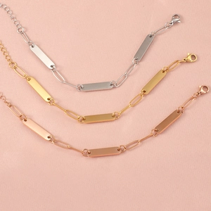 Polished stainless steel paperclip bracelets in gold, silver, and rose gold finishes