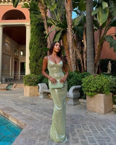 Detail of sage green sequin maxi dress featuring slim fit mermaid cut and thin straps