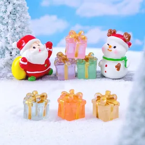 Miniature Christmas resin figurines with Santa, snowmen and colorful luminous gift boxes