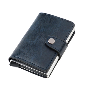 Detail view of RFID blocking slim wallet with blue textured leather and metal card slot