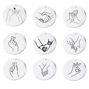Lot de 9 pendentifs ronds en acier inoxydable avec gravures de gestes noirs
