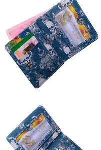 Detail of navy blue skull wallet interior with multiple card slots and ID window