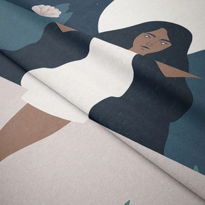 Detail of bohemian tapestry fabric showing soft texture and printed woman illustration