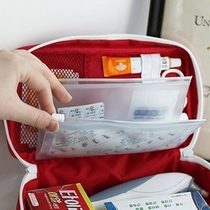 Red portable first aid medical organizer bag with multi-compartment interior storage