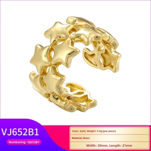 Macro shot of 18K gold plated brass ring featuring irregular 3D star-shaped textures
