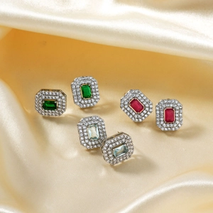 Retro rectangle zircon stud earrings in green, red and blue on gold satin fabric