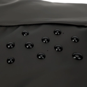 Waterproof matte black chest bag with water droplets showcasing premium water resistance