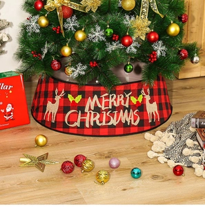 Close-up of red and black buffalo plaid Christmas tree skirt with reindeer applique