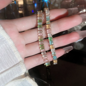 Detailed shot of adjustable tennis bracelet with colorful rectangular-cut zircon stones