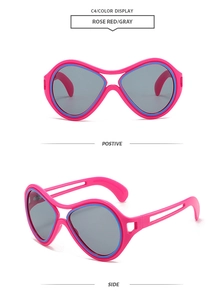 Macro side view of rose red fashion sunglasses with gray lenses and thick plastic frames