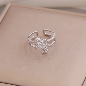 Sparkling silver unicorn open ring with micro-set zircons on a champagne jewelry box