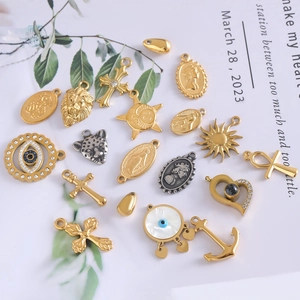Assorted gold stainless steel sun and cross pendants with evil eye and animal charms