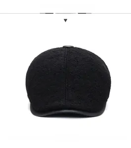 Detailed front view of men's winter cap with warm plush fabric and black leather brim