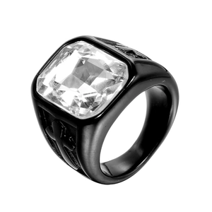 Detailed macro view of black titanium cross ring featuring a large square clear gemstone