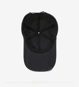 Close-up of breathable mesh inner structure and adjustable strap on black baseball cap