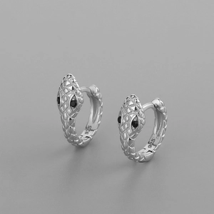 Elegant 925 sterling silver snake hoop earrings with black eyes on grey background