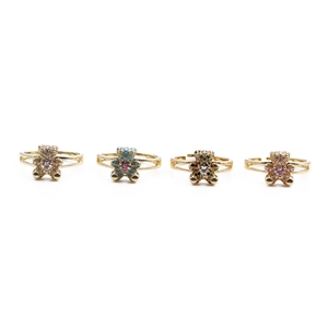Detail of four colorful bear rings with gold plating and micro-set cubic zirconia