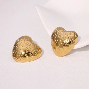 Textured gold heart stud earrings in minimalist titanium steel with hammered finish