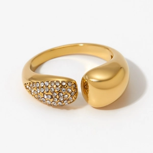 Polished gold teardrop open ring with crystal pavé setting on white background