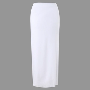 Detail of the high waist cut and flowing white fabric texture of the maxi dress