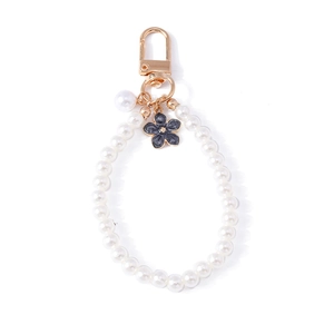 Elegant floral pearl beaded keychain with gold metal clasp and grey flower pendant charm