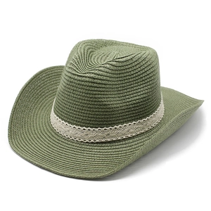 Detail view of ethnic jazz sun hat featuring green straw weave and lace ribbon band