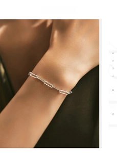 Close-up of s925 sterling silver paperclip bracelet with sandblasted texture on wrist